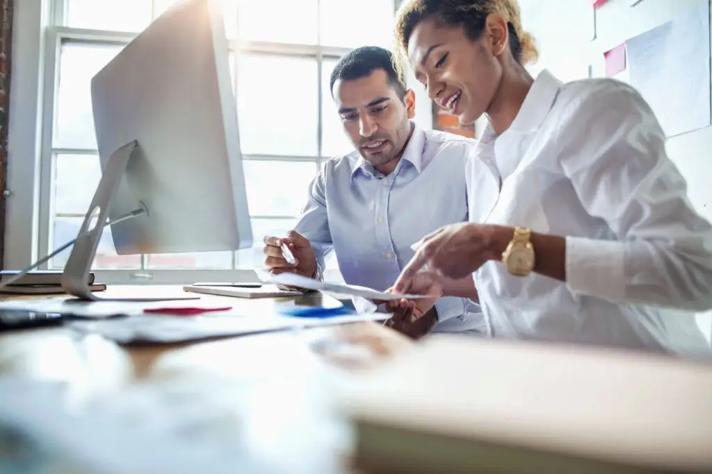 Real estate investor comparing DSCR and conventional loan scenarios with an advisor